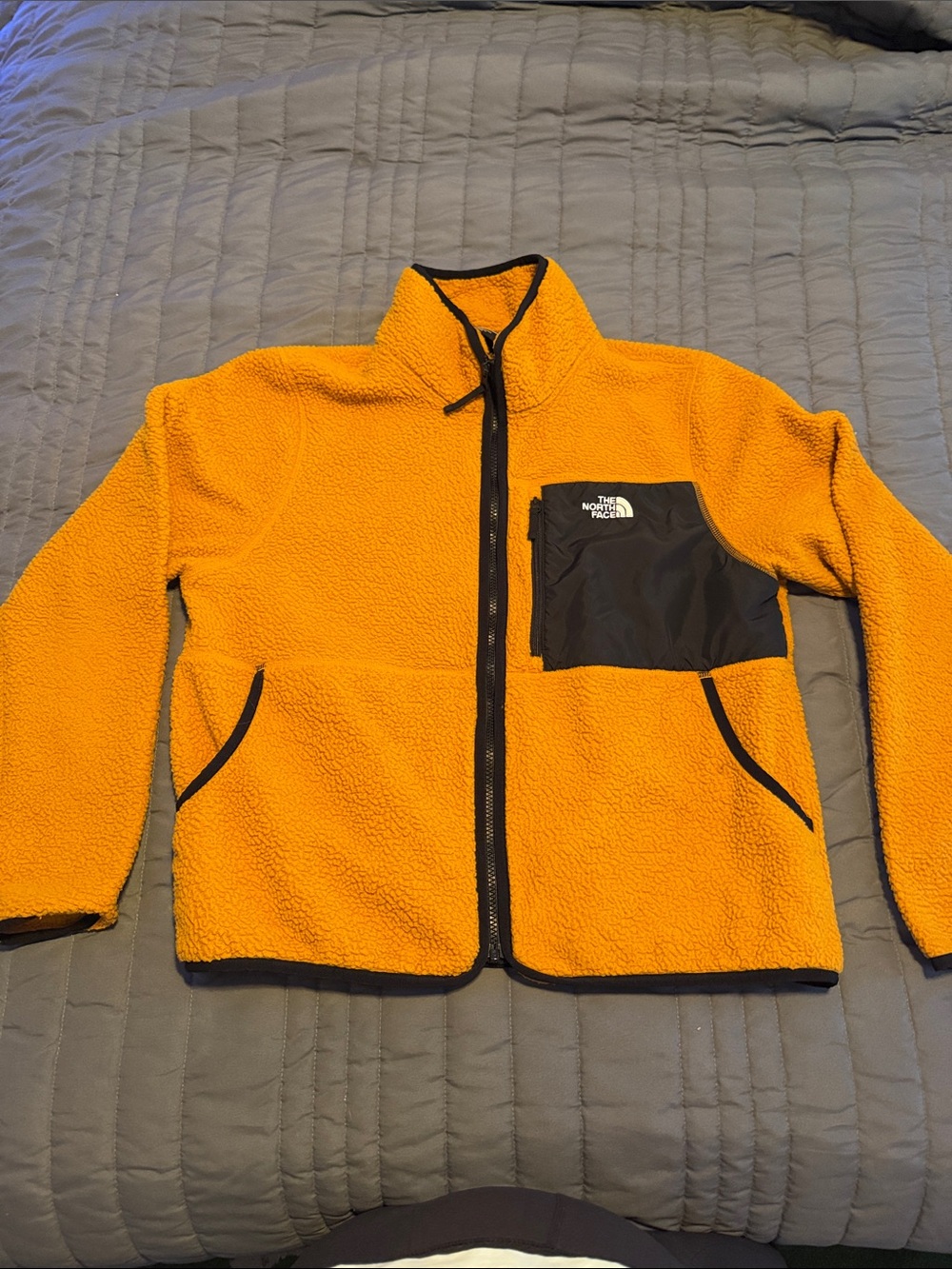 The North Face Bright Orange Sherpa Fleece Jacket with Black Chest Pocket